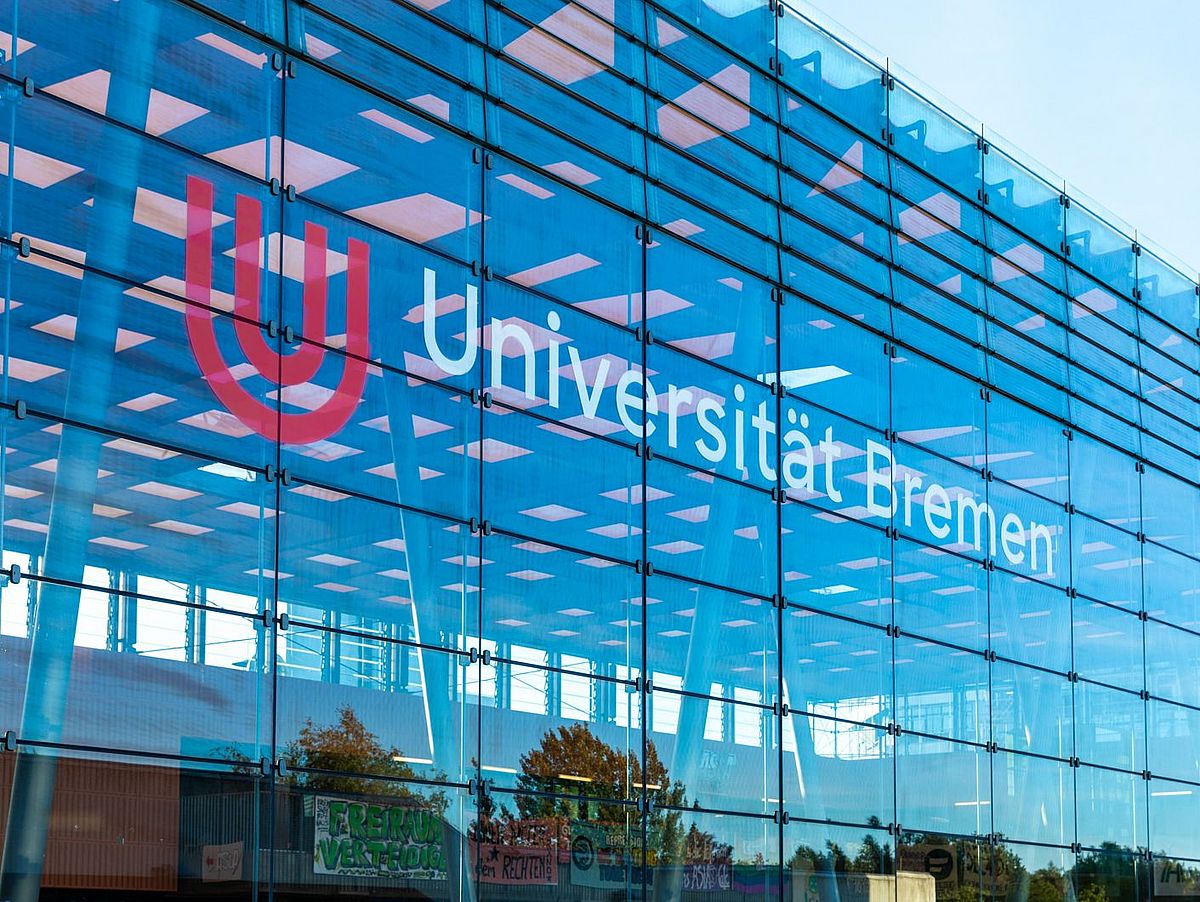 Glass hall with the university logo