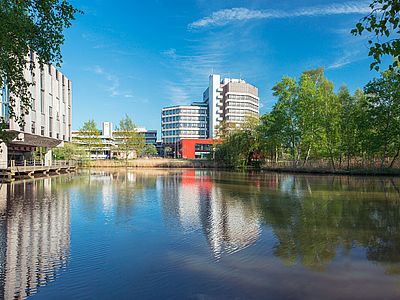 The MZH reflected in a Lake in Campus Park.