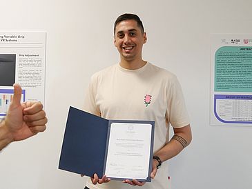 Nima with his certificate, ©I.Laumann