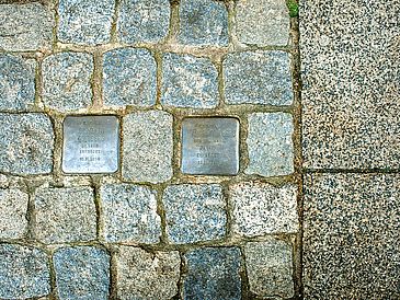 Stolpersteine (stumbling stones) on the street