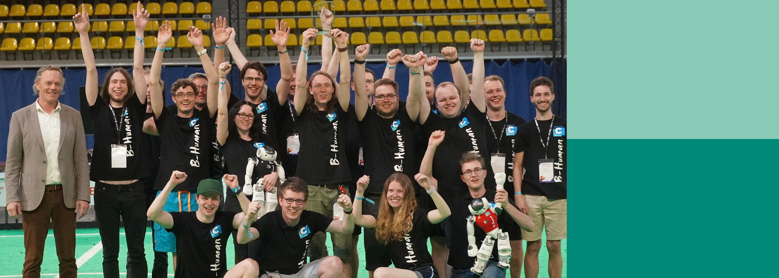 B-Human group photo with two robots