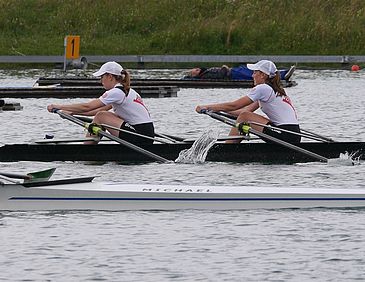 Two women on a rowing boat during a competition