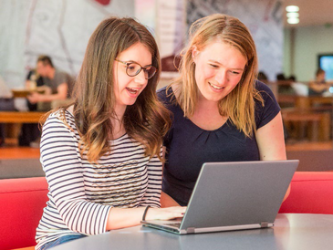 Picture of 2 Students sitting at a Table