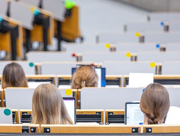 Students sitting in the auditorium during a lecture