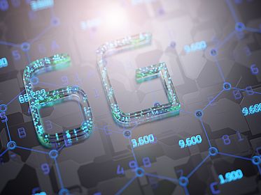 AdobeStock_0uJuUU.jpg Gestalteter 6G-Schriftzug in leuchtenden Farben auf dunklem Hintergrund