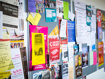 Bulletin board full of notes.