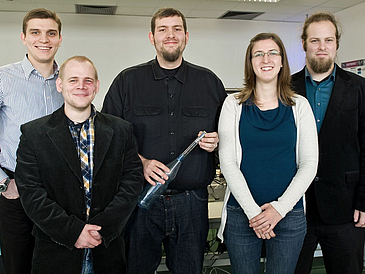 Photo of a group of five men and one woman