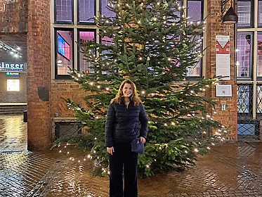 Elizabeth in front of a Christmas tree in Bremen
