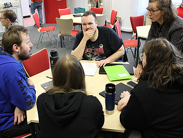People on a Table with Christine Knipping